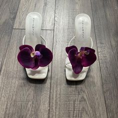 Real touch Deep/Dark Purple Orchid Flower 🍇open toe sandal heels 🌺 Comes with necklace & Gift Box 💝 Available in a black or white shoe. This is the listing for the white. Free shipping 💌✈️ Available shoe size is EU 35 - 40 💌 The heel height is 2.8 inches  Please order the correct shoe size, if your shoe size is not listed please find the thong style shoe listing which offers larger sizes 👠 Delivery time information: Please allow up to 14 days for your item to be made and posted 💌 Open toe Dark Purple Heels Wedding, Purple Sculpted Heel Spring Heels, Orchid Shoes, Purple Sculpted Heel Summer Heels, Orchid Heels, Purple Sculpted Heel Evening Heels, Plum Heels, White Flower-shaped Elegant Sandals, Strap Sandals Heels