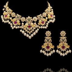 Celebrate this festive season with style in our Sonakshi Set! Stunning set featuring delicate CZ stones paired with dangling pearl beads. The set includes a necklace and a pair of matching earrings. Approximate earrings length is 2". Gold-plated on high-quality brass as base metal. Made by order. Kindly allow 5-7 weeks for the delivery of this item. For custom or urgent requests, please contact support@alacouture.com. *Please Note: We use faux stones and beads in all of our jewelry. Festive Kundan Necklace With Pearl Drop For Celebrations, Diwali Temple Jewelry Set With Pearl Drop, Festive Chandbali Bridal Necklace With Pearl Drop, Bollywood Bridal Necklace With Pearl Drop, Bollywood Bridal Necklace With Pearl Drop For Festive, Festive Bollywood Bridal Necklace With Pearl Drop, Festive Diwali Pearl Drop Jewelry Sets, Temple Jewelry Sets With Pearl Drop For Festive Occasions, Temple Jewelry Sets With Pearl Drop For Festive Season