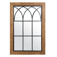 a wooden window with an arched glass on the top and bottom panel, against a white background