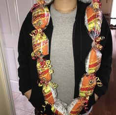 a person wearing a hoodie with candy wrapped around it