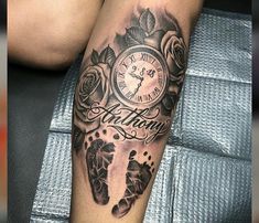 a black and white photo of a clock with roses on it