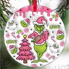 an ornament hanging from a christmas tree with the grinch on it's face