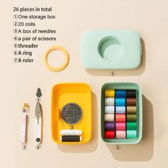 the contents of a sewing kit laid out on a table