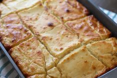 a pan filled with bread sitting on top of a table