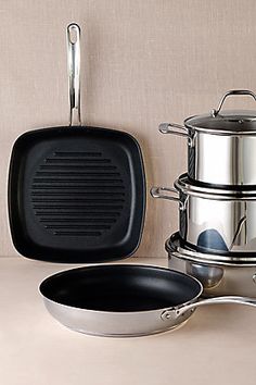 pots and pans are sitting next to each other