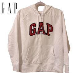 Adorable Hoodie By Gap. Color Is White. Gap Appliqu On Front. Size Is Medium. Drawstring Hood. Ribbed Cuffs And Hemline. Please View Last Picture To See A Very Small Pinhole From A Tag In The Left Hand Cuff. Front Pockets. Pit To Pit Is 20. 5 Inches Length Is 24 Inches. Material Is 60% Cotton 40% Polyester Exclusive Of Decoration. Cheap Cute Gap T-shirt, Cheap White Gap Shirt, Affordable Gap T-shirt For Streetwear, Cheap Fitted Gap Shirt, Cheap Gap Long Sleeve Shirt, Cheap Long Sleeve Gap Shirt, White Gap Tops For Streetwear, Sporty White Gap Tops, Sweatshirts Hoodie Women