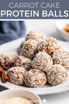 carrot cake protein balls on a white plate with cinnamon sticks and spices in the background