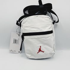 Jordan Airborne Festival Bag Crossbody White Jumpman Fanny Pack White Sporty Crossbody Bag, Sporty White Crossbody Bags, White Rectangular Chest Bag For School, White Chest Bag With Mobile Phone Pocket For School, Sporty White Bag With Pockets, White Pouch Chest Bag With Removable Pouch, White Pouch Shoulder Bag With Zipper Closure, Casual White Pouch Chest Bag, White Crossbody Chest Bag For School