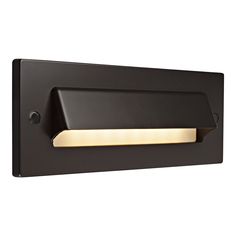 an outdoor wall light that is black and has a white light on the outside side