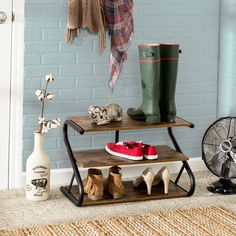 a pair of boots and some shoes on a shelf