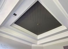 the ceiling in this room is painted black and white