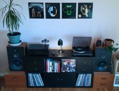 an entertainment center with record players and records