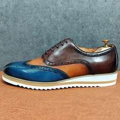 Introducing the LuxeExo Round Toe Lace-up Brogue Shoes, the epitome of timeless elegance and sophistication. Crafted with the finest quality genuine leather, these brogue shoes are a must-have addition to any gentleman's wardrobe. With a true-to-size fit and a perfect blend of style, comfort, and quality, elevate your footwear collection and order now to experience the ultimate in luxury. Blue Low-top Dress Shoes For Business, Classic Blue Pointed Toe Oxfords, Blue Brogue Lace-up Dress Shoes, Blue Leather Brogue Lace-up Shoes, Blue Lace-up Oxfords For Business, Blue Oxford Leather Shoes With Plain Toe, Blue Lace-up Leather Shoes With Brogue Detailing, Blue Wingtip Oxfords, Blue Low-top Dress Shoes For Formal Occasions