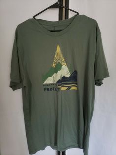 ‎ Men's United By Blue Organic Short Sleeve Graphic T-Shirt Green XL #UnitedByBlue Green Cotton Shirt For Outdoor, Green Cotton Outdoor Shirt, Summer Outdoor Cotton T-shirt, Blue Cotton Tops For Outdoor, Outdoor Blue Cotton Tops, Cotton Graphic Tee For Outdoor, Outdoor Green T-shirt With Graphic Print, Green Graphic Print Outdoor T-shirt, Green Graphic Print T-shirt For Outdoor