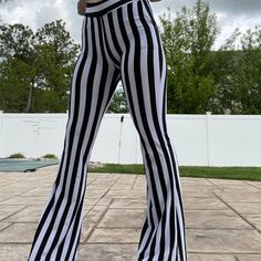 The Perfect Gift for Valentine's Day, Christmas, Birthday, Wedding, and Anniversary! The perfect outfit for renaissance fairs, nightlife, Halloween parties, raves, concerts, and more. Light and comfortable for all-day use! Express your style or be the life of the party with one of our White Striped High Waist Flare Trouser Pants. These Flare Trousers Pants are made of polyester. Complete the look with fashionable accessories such as a belt, purse, cuffs, top sleeve, etc. (not included). Package Includes 1 * White Striped High Waist Flare Trouser Pants US orders - Delivery in 12-15 business days once shipped. Ships worldwide. Allow 2-3 weeks for international shipping. High Waist Fitted Bottoms For Festival, Fitted Gothic Bottoms For Spring, White Party Pants For Fall, High Waist Rave Bottoms For Party, Fitted Bottoms For Cosplay In Spring, Gothic High Waist Bottoms For Spring, High Waist Stretch Bottoms For Rave, Gothic Bottoms For Spring Concert, Rave Style Party Bottoms For Summer