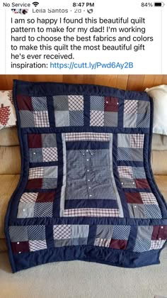 a couch with a blue and red patchwork quilt on it's back end