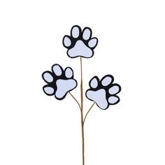 three paw prints are shown on the top of a plant with white and black stems