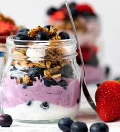 yogurt parfait in a glass jar with blueberries and strawberries