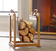 a stack of logs sitting in front of a fire place