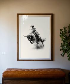 a black and white photo of a man on a horse in a room with a bench