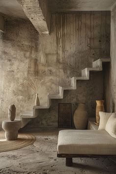 a living room filled with lots of furniture and vases on top of it's shelves