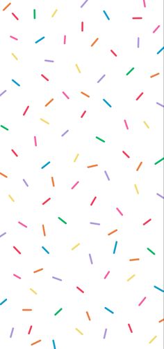 colorful sprinkles on a white background that looks like they are going to fall