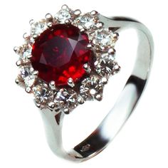 A deep red ruby hand-picked from the Haruni vault makes a striking centrepiece for this spectacular white gold ring. The round cut stone boasts a rich, vivid colour, further amplified by its surround of sparkling white diamonds. This is an eye-catching yet truly timeless piece, perfect as a gift for someone special. Ring Size: UK - M, US - 6 1/2 1.59 Carats Ruby 10/0.70 Carats Diamonds Special Ring, Fine Jewels, Ruby Diamond, Red Ruby, White Gold Ring, White Gold Rings, Cocktail Rings, Deep Red, Diamond White