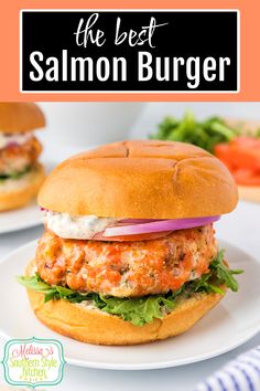 the best salmon burger with lettuce, tomato and mayonnaise on a white plate