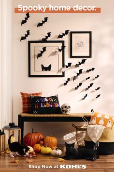 halloween decorations with bats and pumpkins on the wall