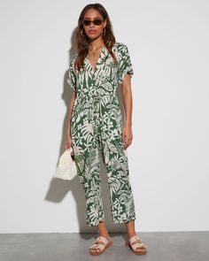 Fitted waist V-neckline Tropical print Front buttons Short sleeve Side pockets 80% Rayon 20% Linen Vici Collection, Festival Shop, Select Shop, Print Jumpsuit, Green Jumpsuit, Printed Jumpsuit, Tropical Print, Trending Now, Dress Backs