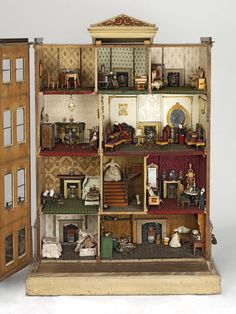 a doll house is shown with all the furniture and accessories in it's display case