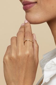 Our Everything Stack Ring is as versatile as it is shiny. The gentle curve of this comfort fit band gives it a slight dome effect while remaining gorgeously classic. This is a must-have for any curated jewelry collection as you can wear it on any finger solo or in a stack. P.S. this also makes a great wedding band! Metal: 14 Karat Yellow Gold Dimensions: 2mm Band Width Weight: 0.7 Grams Available in Multiple Sizes Origin: Crafted in Bologna, Italy Band Metal, Bologna Italy, Stack Ring, Bologna, Stacking Rings, Wedding Band, Wedding Bands, Jewelry Collection, Comfort Fit