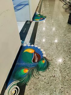 the floor is decorated with peacock feathers and has been painted to look like it's coming out of an open door