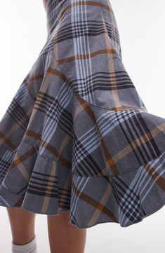 A classic plaid pattern accentuates the artsy, purposely disjointed look of this skirt cut with swooping asymmetric seams. 26" length (size Ts-8) Hidden side-zip closure 97% Cotton,3% Elastane Machine wash, line dry Imported Plaid Flared Relaxed Fit Skirt, Plaid Flared Skirt With Relaxed Fit, Plaid Flared Skirt, Plaid Cotton Tiered Skirt Bottoms, Plaid Cotton Tiered Skirt, Plaid Tiered Lined Skirt, Plaid Cotton Flared Skirt, Cotton Plaid Flared Skirt, Plaid Cotton Skirt For Work