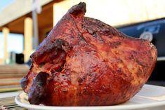 a piece of meat sitting on top of a white plate