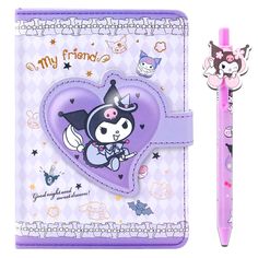 a purple notebook with a cartoon character on it and a pink pen next to it