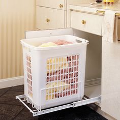 a white plastic container sitting on top of a metal shelf next to a cabinet door