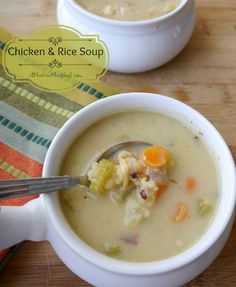 two bowls filled with soup on top of a wooden table