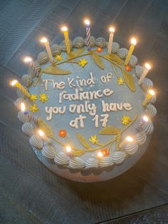 a birthday cake with lit candles on it that says the kind of radiance you only have at 1