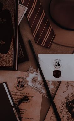 an envelope and harry potter memorabilia are on the table