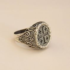 Jerusalem Ring 925 Sterling Silver Handmade Ring The details of Jerusalem Cross were made in order to make it look like carved inside a wood. There's Holy Trinity symbol at the bottom of the sides and a shining Cross above. In the middle sides of the ring, Templar Cross was engraved. The design is open for your customization as you would like... We ship our products with UPS express (within 3-5 days delivery) The production time is 2-3 business days. All sizes are available, please just tell me Artisan Engraved Signet Ring For Anniversary, Antique Carved Sterling Silver Signet Ring, Artisan Silver Rings With Carved Details, Antique Engraved Sterling Silver Ring, Antique Carved Sterling Silver Rings, Antique Carved Sterling Silver Engraved Ring, Artisan Carved Silver Rings, Silver Carved Symbolic Signet Ring, Carved Silver Symbolic Signet Ring