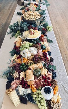 a long table covered in lots of different types of food