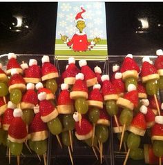 the grinch hats are made out of strawberries and peppers on skewers