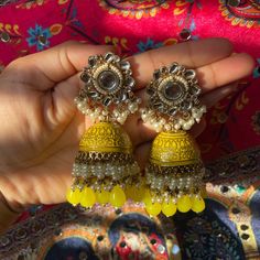 Heavy Jhumka Color: Yellow Condition: Brand New Brand: Nimsim Accessories Message For Inquiries Fusion Style Festive Jhumkas With Gota Work, Festive Fusion Gota Work Jhumkas, Festive Fusion Jhumkas With Gota Work, Gold Jhumkas With Mirror Work, Fusion Style Jhumkas With Gota Work For Festivals, Mirror Work Jhumkas For Diwali, Diwali Mirror Work Jhumkas, Festive Yellow Chandbali Jhumkas, Festive Yellow Jhumkas With Latkans