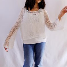 Open knit sweater, the sleeves are large, not tight on wrist.  This sweater is made of natural cotton. SIZE: 2 sizes: Petite: 50 cm long x 50 cm large Regular: 58 cm long x 55 cm  Country of origin: Proudly designed and made in Italy by Piera Romeo CARE: Hand wash in cold, gentle water using a mild detergent Do not bleach Do not rub or wring Squeeze out excess water Gently pull the wet garment into shape Dry flat in the shade Do not tumble dry COLORS: white, beige, blue navy, denim, brown, dark red, black, light grey, dark grey, military green, light pink Red Christmas Jumper, Personalized Sweater, Cropped Pullover, Xmas Sweater, A Wedding Dress, Open Knit Sweater, White Sweater, Long Dresses, Knit Cotton