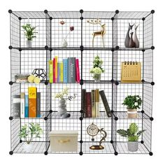 a book shelf with many books and plants on it