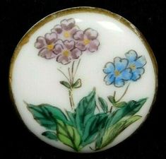 a white plate with flowers painted on it