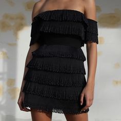 This Pleated Frill Mini Dress Features: Rrp: $249.00 Laser Cut Pleated Frill Tiers Black Off The Shoulder Fully Lined Boned Mini Length Centre Back Gold Metal Zipper Hook And Eye Fastening Delicate Embellished Fabric Material: Body: 100% Polyester, Lining: 95% Polyester, 5% Spandex Model Is 5”11 Tall And Is Wearing A Au Size 8 Chic Fringe Mini Dress For Date Night, Flirty Fringe Mini Dress, Spring Black Mini Dress With Fringe, Chic Black Fringe Dress, Black Strapless Dress For Brunch, Black Fringed Cocktail Dress, Spring Black Fringe Dresses, Texas Dress, Embellished Fabric