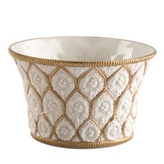 a white bowl with gold trimmings on the rim and bottom, sitting in front of a white background