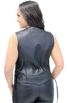 Black vest for women with side lace and braid trim. This women's vest is made with premium top grain Ultra Premium cowhide leather. The rawhide leather side lacing in this women's leather vest is adjustable and will give you the option to let it out for a more comfortable fit. Features of this versatile women's motorcycle vest include two front pockets, inside chest pocket and a soft nylon lining. Also a great choice for a plus size leather vest! Sizes: S, M , L, XL, 2XL, 3XL, 4XL, 5XL. +$6 for 2X-3X, +$12 for 4X-5X. [4#] braid trim front and back durable dark colored snaps leather braid trim adjustable side lacing two front pockets four snap up front inside chest pocket 20" average length (size dependent) top grain leather premium buffalo leather IMPORTANT SPECIFICATIONS: MANUFACTURER: Th Fitted Biker Vest For Fall, Fitted Leather Biker Vest, Fitted Leather Vest For Fall, Fitted Leather Casual Vest, Casual Fitted Leather Vest, Fitted Leather Sleeveless Vest, Long Leather Vest, Plus Size Leather, Women Leather Vest